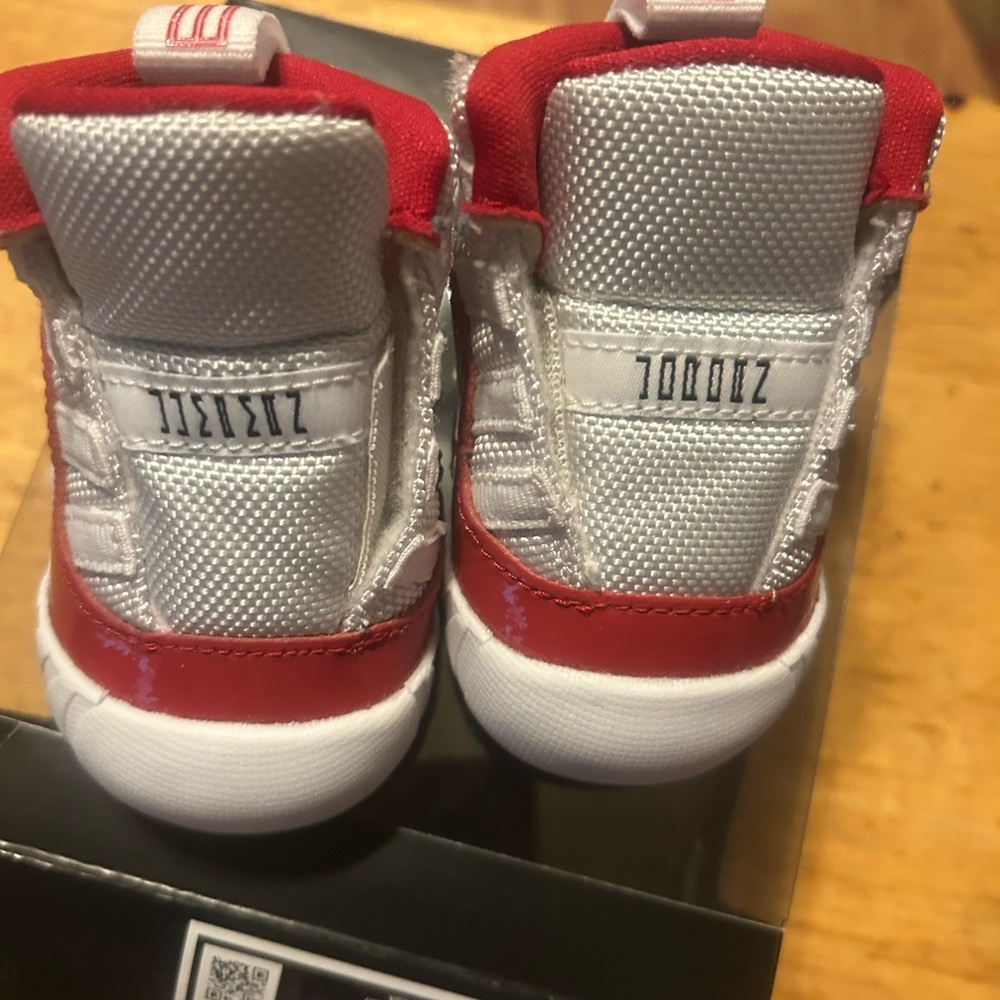 Red and white Jordan 11 crib bootie size 2C